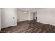Inviting room boasts hardwood floors and an elegant chandelier, perfect for comfortable living at 4502 E Carol Ave # 4, Mesa, AZ 85206