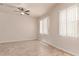 Bright bedroom featuring tiled floors, neutral paint, recessed lighting and a ceiling fan at 4724 S Anitole Way, Mesa, AZ 85212