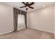Comfortable bedroom with carpet and elegant window treatments at 4724 S Anitole Way, Mesa, AZ 85212