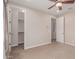 Neutral bedroom with carpet flooring and ceiling fan at 4724 S Anitole Way, Mesa, AZ 85212