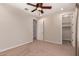 Inviting bedroom featuring a ceiling fan and carpet flooring for added comfort at 4724 S Anitole Way, Mesa, AZ 85212