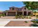 Well-maintained two-story home with desert landscaping and a paver driveway at 4724 S Anitole Way, Mesa, AZ 85212