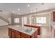 This kitchen features granite islands with a sink, a clear view to the living spaces, and modern lighting at 4724 S Anitole Way, Mesa, AZ 85212