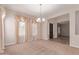 Inviting living room features elegant chandelier and large windows with decorative valances at 4724 S Anitole Way, Mesa, AZ 85212