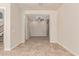 Spacious living room with tile flooring leads to another room with neutral carpeting at 4724 S Anitole Way, Mesa, AZ 85212