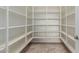 Walk-in pantry with white shelves for organized storage at 4724 S Anitole Way, Mesa, AZ 85212