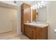 Bathroom vanity with storage, a large mirror, and tile flooring at 4808 N 24Th St # 923, Phoenix, AZ 85016