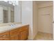 Bathroom featuring a vanity with storage, a large mirror, and a glass-door shower at 4808 N 24Th St # 923, Phoenix, AZ 85016