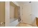 Bathroom featuring a shower/tub combo with a curtain and a toilet paper holder at 4808 N 24Th St # 923, Phoenix, AZ 85016