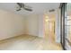 Bedroom featuring hardwood floors, a ceiling fan, and a view out of large windows at 4808 N 24Th St # 923, Phoenix, AZ 85016