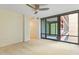 Bright bedroom with large windows allowing ample natural light and a ceiling fan at 4808 N 24Th St # 923, Phoenix, AZ 85016
