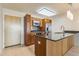 Modern kitchen with stainless steel appliances, granite countertops, and custom wood cabinetry at 4808 N 24Th St # 923, Phoenix, AZ 85016