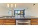 Modern kitchen with stainless steel appliances and a large window with city views at 4808 N 24Th St # 923, Phoenix, AZ 85016