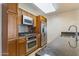 Updated kitchen features stainless steel appliances, stone countertops, and wood cabinets at 4808 N 24Th St # 923, Phoenix, AZ 85016