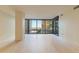 Open living room with large windows showcasing a city view and light hardwood floors at 4808 N 24Th St # 923, Phoenix, AZ 85016