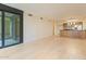 Open living space with access to a balcony, showcasing the kitchen and hardwood floors at 4808 N 24Th St # 923, Phoenix, AZ 85016
