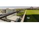 Scenic rooftop featuring synthetic grass and a glass barrier providing unobscured city and mountain views at 4808 N 24Th St # 923, Phoenix, AZ 85016