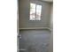 Cozy bedroom featuring neutral walls, carpeted floors, and a window for natural light at 4930 W Brown St, Glendale, AZ 85302