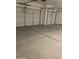 Spacious 2-car garage with epoxy flooring, ready for vehicles and storage at 4930 W Brown St, Glendale, AZ 85302