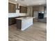 Spacious kitchen features a central island, stainless steel appliances, and ample cabinet space at 4930 W Brown St, Glendale, AZ 85302