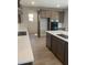 Bright kitchen featuring sleek countertops, a central island, and modern appliances at 4930 W Brown St, Glendale, AZ 85302
