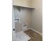 Well-equipped laundry room with plumbing, electrical, and a storage shelf at 4930 W Brown St, Glendale, AZ 85302