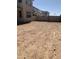 An empty backyard shows room for potential, surrounded by a block wall at 5004 W Brown St, Glendale, AZ 85302
