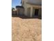 The backyard features a covered patio and door to enter the garage at 5004 W Brown St, Glendale, AZ 85302