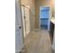 This bathroom includes a glass shower and walk in closet, with beige tile flooring at 5004 W Brown St, Glendale, AZ 85302