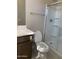 Modern bathroom with a glass-enclosed shower and tiled floor at 5004 W Brown St, Glendale, AZ 85302