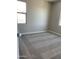 Bright bedroom with soft carpet, providing a cozy space with lots of natural light at 5004 W Brown St, Glendale, AZ 85302