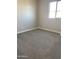 Neutral carpeted bedroom featuring a window with natural light that complements the space at 5004 W Brown St, Glendale, AZ 85302