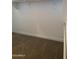 A view of the well-organized closet space, featuring wood rods and carpet flooring at 5004 W Brown St, Glendale, AZ 85302
