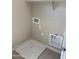 Laundry room with the connections and space for a washer and dryer and tile flooring at 5004 W Brown St, Glendale, AZ 85302