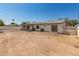 Backyard with a dirt yard and concrete patio at 501 W Dublin St, Chandler, AZ 85225