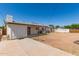 View of the home's backyard featuring a patio and a yard at 501 W Dublin St, Chandler, AZ 85225