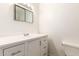 Modern bathroom with a vanity, chrome faucet, and white cabinets at 501 W Dublin St, Chandler, AZ 85225
