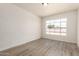 Bright bedroom with wood-look floors and a large window, creating a serene atmosphere at 501 W Dublin St, Chandler, AZ 85225