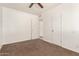 Bright bedroom with two doors, neutral paint, and carpet at 501 W Dublin St, Chandler, AZ 85225