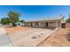 Charming single-story home featuring a covered carport, stone accents and a long driveway at 501 W Dublin St, Chandler, AZ 85225