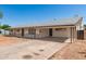 Charming single-story home featuring a covered carport, stone accents and a long driveway at 501 W Dublin St, Chandler, AZ 85225