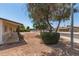 Charming single-story home featuring stone accents, mature trees and a covered patio at 501 W Dublin St, Chandler, AZ 85225
