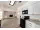 Kitchen flows into living room featuring granite countertops and appliances at 501 W Dublin St, Chandler, AZ 85225