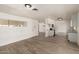 Open-concept living room flows into kitchen featuring wood-look flooring at 501 W Dublin St, Chandler, AZ 85225