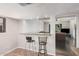 Interior bar area with tiled floors and granite countertop at 5314 N Las Casitas Pl, Phoenix, AZ 85016