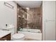 A bathroom featuring an enclosed shower, tile walls, and a toilet at 5314 N Las Casitas Pl, Phoenix, AZ 85016