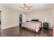 Main bedroom with dark floors and access to an organized walk-in closet at 5314 N Las Casitas Pl, Phoenix, AZ 85016