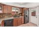 Another angle of the updated kitchen showcasing stainless steel appliances and granite countertops at 5314 N Las Casitas Pl, Phoenix, AZ 85016
