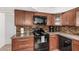 A close-up showcases the kitchen's updated features, including granite counters and modern appliances at 5314 N Las Casitas Pl, Phoenix, AZ 85016