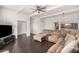 Relaxing living room with a large sectional, open floor plan, and easy access to the kitchen at 5314 N Las Casitas Pl, Phoenix, AZ 85016